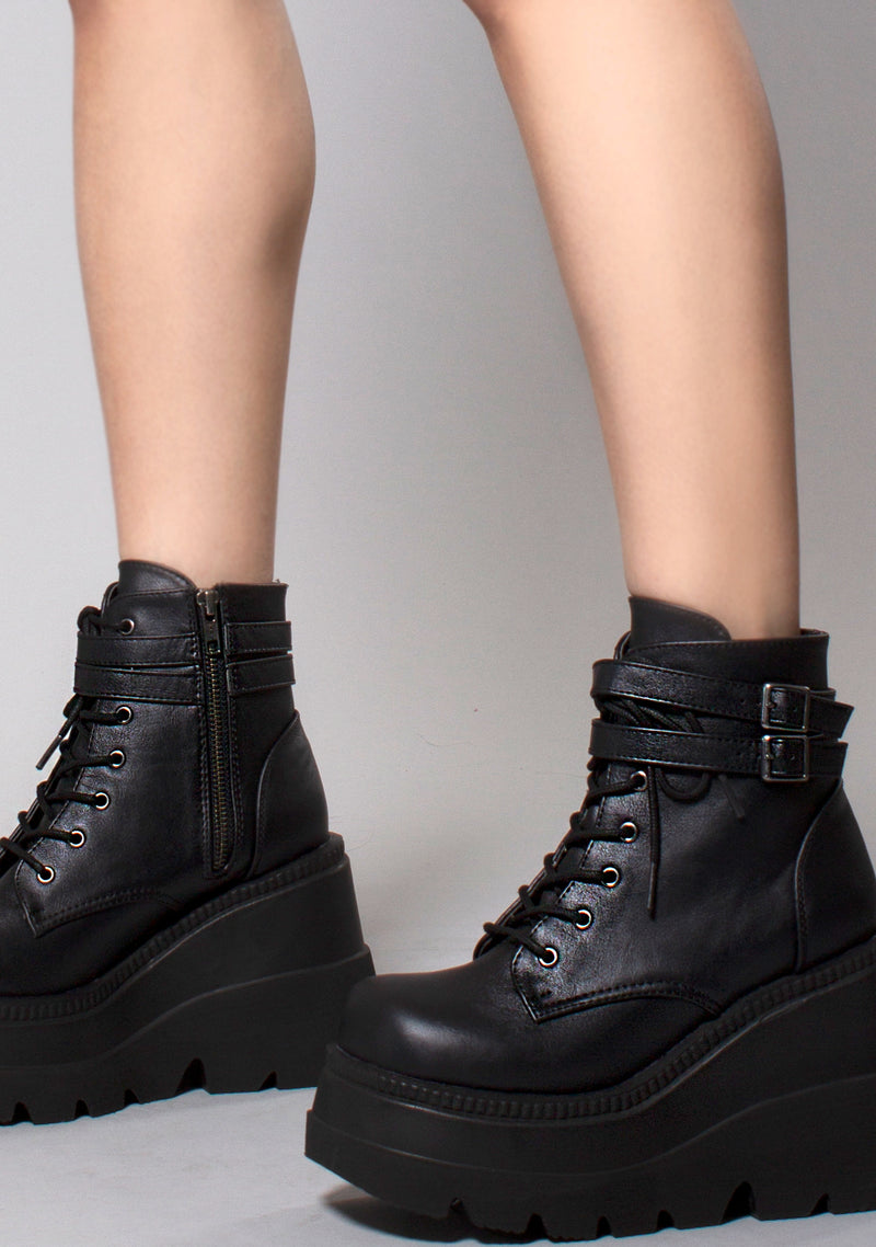 Demonia Shaker Platform Boots in Black